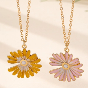 Chic gold-plated daisy pendant necklaces with vibrant yellow and soft pink enamel petals