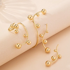 Elegant gold metal bead earrings and cuff set with minimalist organic curves for women