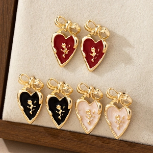 Retro heart stud earrings with enamel bow and golden rose detail in three colors