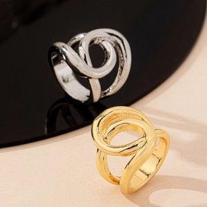 Minimalist intertwined crossover rings in gold and silver finish with high metallic luster