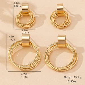 Minimalist gold tiered hoop earrings set in small and large geometric circle designs