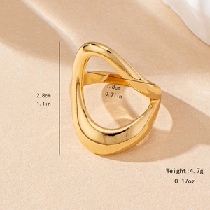 Golden irregular open ring with dimensions and weight specs on a beige background