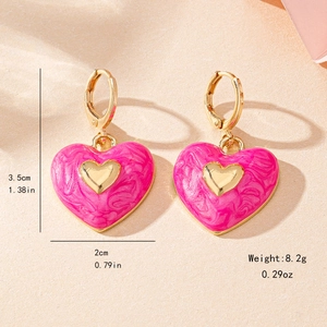 Fashionable pink enamel heart drop earrings with marble texture and gold heart detail