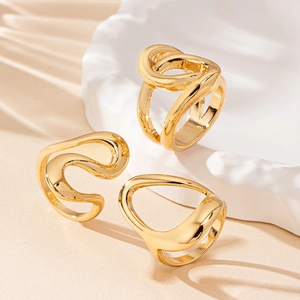 Three-piece set of golden irregular fluid design rings with abstract artistic metallic style