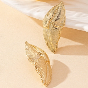 Detailed close-up of elegant gold leaf earrings showing intricate vein textures and metallic shine