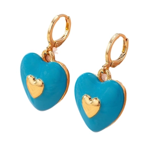 Fashionable heart earrings with blue enamel and gold finish on a clean white background