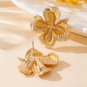 Elegant gold flower stud earrings with brushed metallic texture and petal details