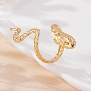 Elegant gold snake-shaped open ring with detailed scale engraving and glossy metal finish