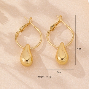 Polished gold teardrop earrings for women, minimalist 4cm drop design on a textured background