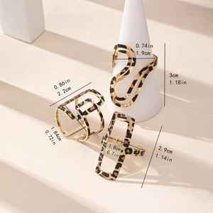 Three-piece gold leopard print ring set featuring geometric square and hollow shapes