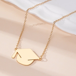 Minimalist golden graduation cap pendant necklace with polished finish on O-chain