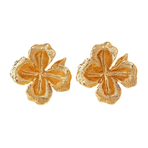 Fashionable golden flower stud earrings with vintage embossed metal texture on white background