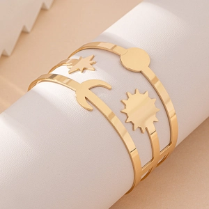 Retro hollow golden arm cuff bracelet featuring sun, moon, and star celestial motifs