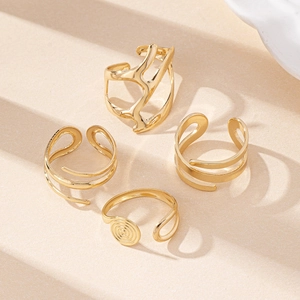 Detailed view of 4-piece set of golden irregular geometric open rings for women