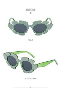 Close-up of green glitter flower-shaped sunglasses with dark grey lenses in dual views