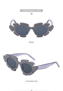 Transparent gray flower shape sunglasses with glitter texture and grey lenses detail
