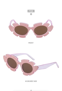 Front and 45-degree side view of pink glitter flower shaped sunglasses for women