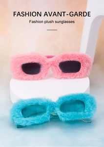 Fashionable plush square sunglasses in pink and blue displayed on white geometric stands