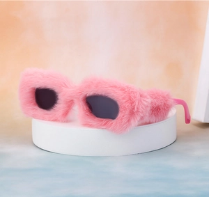 Macro detail of plush pink faux fur frame on square sunglasses with black lenses