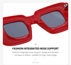 Detail view of the integrated nose support on modern square red frame sunglasses