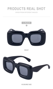 Detailed front and side view of thick-frame square sunglasses in high-gloss black finish