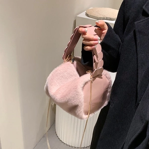 Pink faux fur and leather handbag with petal-shaped handles and metal chain strap