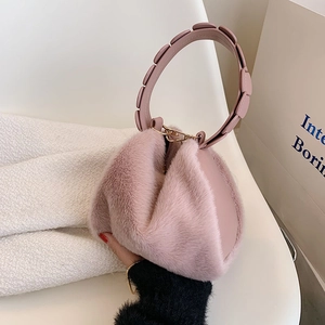 Pink faux fur handbag with unique round handle and gold metal buckles for women