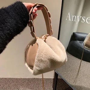 Chic beige faux fur handbag for women with unique petal-shaped handle and gold clasp