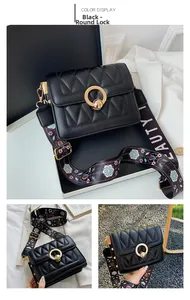 Detail of black quilted shoulder bag featuring gold circular lock and floral wide strap