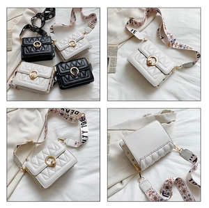 Detail of wide patterned strap and quilted leather small square crossbody bag for women