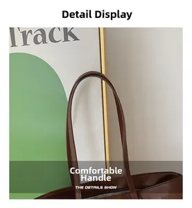 Close-up of comfortable dark brown leather tote handles with high-quality stitching