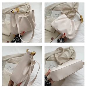 Detail shots of off-white pleated bucket bag featuring golden metal buckles and PU leather