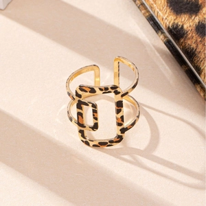 Golden geometric hollow ring with leopard print pattern and rectangular frame design