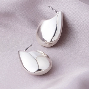 Polished silver teardrop stud earrings with smooth mirror finish and minimalist C-shape design