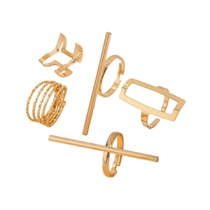 Set of five gold geometric rings featuring butterfly and spiral designs on white background