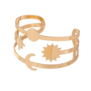 Luxurious gold hollow cuff bracelet featuring sun, moon, and star celestial motifs