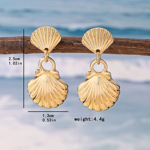 Elegant gold shell drop earrings with radial texture on a beach background, 2.5cm height