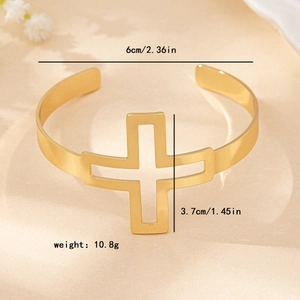 Golden hollow cross cuff bracelet with 6cm diameter and 3.7cm height measurements