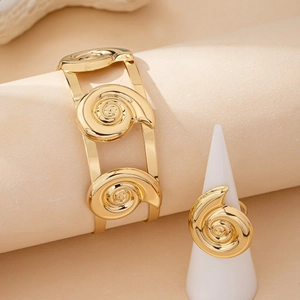 Golden spiral shell bangle and ring jewelry set with polished textured finish