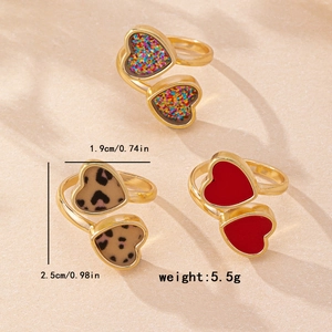 Set of three vintage heart-shaped open rings with leopard print and red enamel finish