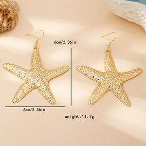 Golden starfish drop earrings with natural biological texture for beach vacations