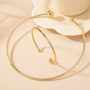 Minimalist gold-plated geometric neck choker and arm cuff set with decorative metal balls