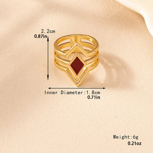 Golden multi-layer hollow geometric ring with red diamond-shaped enamel detail