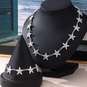 Starfish jewelry set with silver necklace and bracelet featuring zircon stone inlay