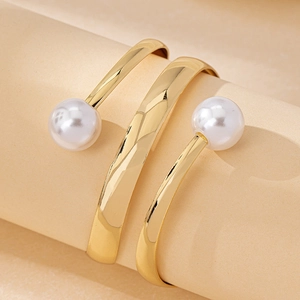 Chic multi-layer hollow open cuff bracelet in gold finish with two round white pearls