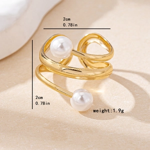 Minimalist double-layer golden open ring with dual white pearls on textured background