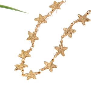 Minimalist gold starfish necklace with textured matte finish and delicate metal chain