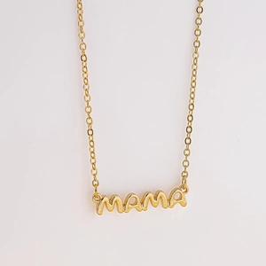 Macro shot of gold MAMA letter pendant with polished finish on a fine O-chain necklace