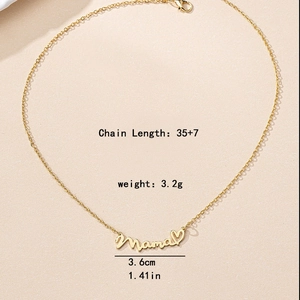 Golden Mama letter necklace with heart pendant on a beige textured background