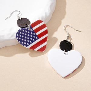 American flag heart earrings with red stripes and blue stars on a beige background
